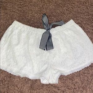 white lace shorts with navy drawstrings